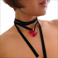A striking red heart pendant on a black velvet choker black sash necklace in red black sash style