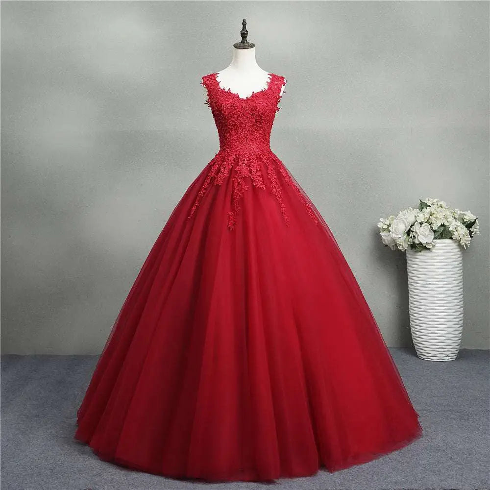 A vibrant red lace bride princess dream tulle gown featuring intricate bodice lace and a flowing skirt