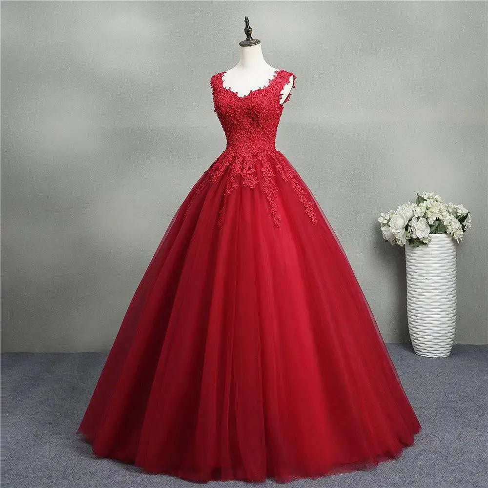 A vibrant red lace bride princess dream tulle gown with intricate lace detailing and a flowing skirt