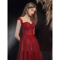 Red lace off shoulder wedding toast dress with shimmering red lace and floral appliqués for hosting annual events