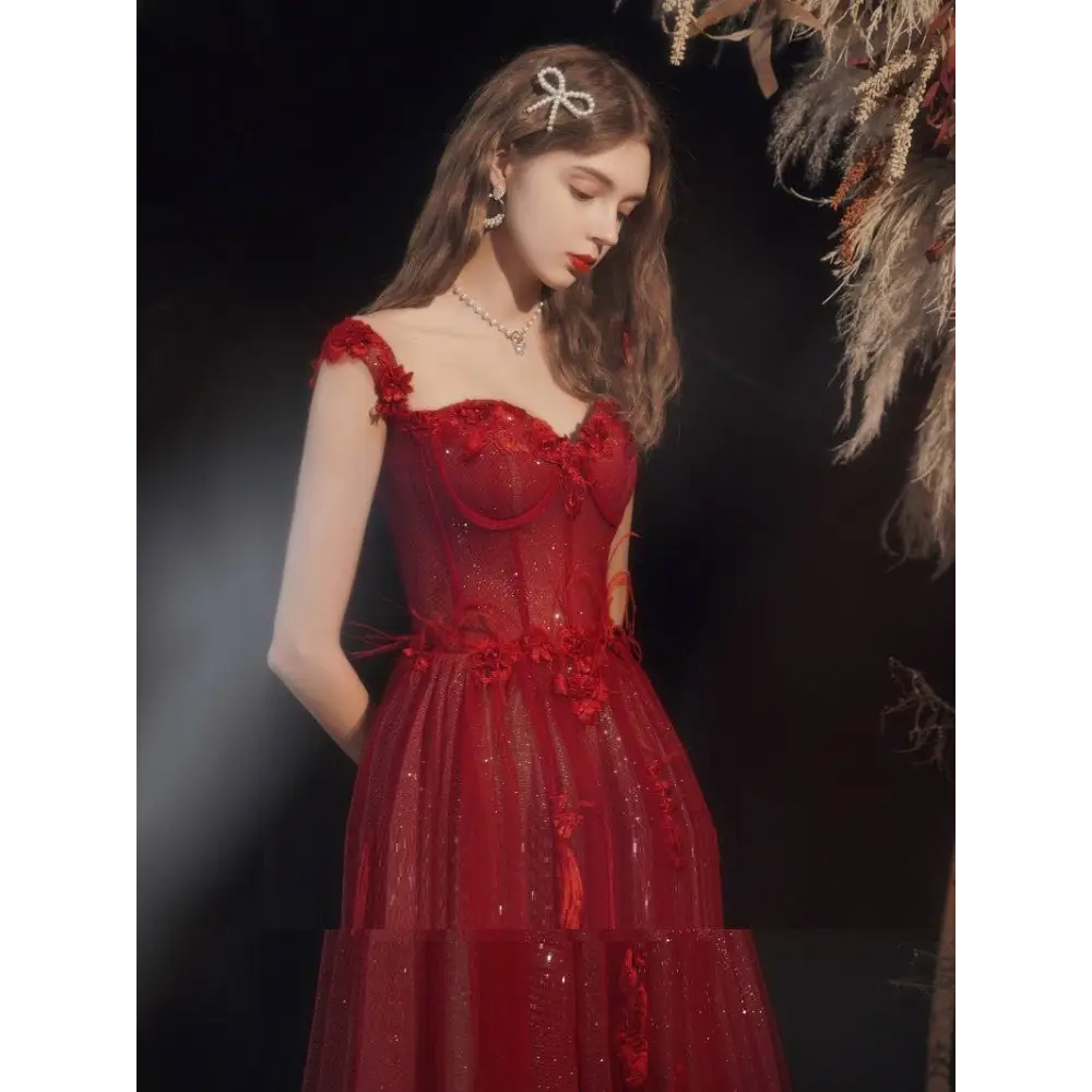Red lace off shoulder wedding toast dress with shimmering red lace and floral appliqués for hosting annual events