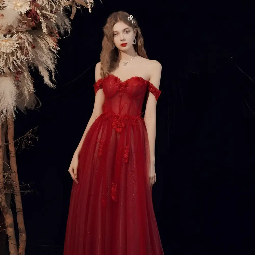 Red lace off shoulder wedding toast dress featuring shimmering red lace and a flowing tulle skirt for host annual events