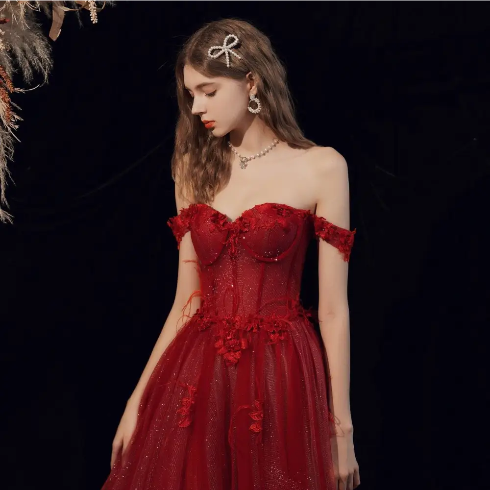 Red lace off shoulder wedding toast dress featuring shimmering red lace with intricate embellishments for host annual events