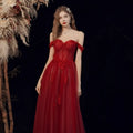 Red lace off shoulder wedding toast dress featuring shimmering red lace and a flowing tulle skirt for host annual events
