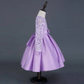 A lavender long sleeve satin princess dress with intricate white lace sleeves and a matching waist bow