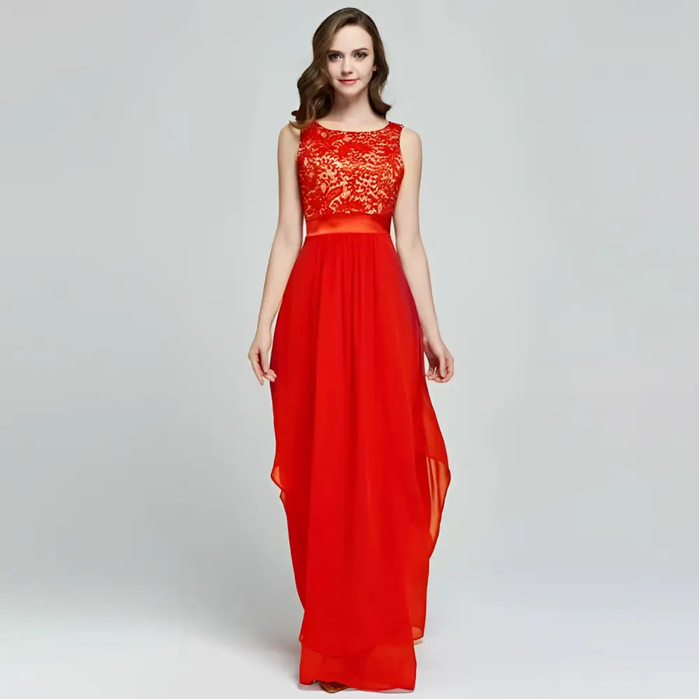 A vibrant red lace spliced chiffon gown featuring an intricate lace bodice and a flowing chiffon skirt