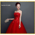Red strapless ball gown wedding evening dress with intricate lace detailing and flowing red lace upscale tulle skirt