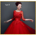 Red lace upscale wedding evening dress with intricate lace detailing three-quarter sheer sleeves and voluminous tulle skirt