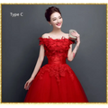 Red lace upscale wedding evening dress featuring intricate lace detailing and a fitted off-the-shoulder bodice