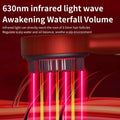 Red and black 630nm infrared light scalp care massage brush with vertical bristles emitting pink and yellow beams