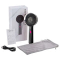 Red light scalp care massage hair growth device handheld in black and pink with circular head and multiple massage nodes