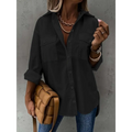 Black loose long sleeve button down shirt with two chest pockets and rolled sleeve lapel design