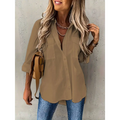 Beige loose long sleeve button lapel shirt with two chest pockets and rolled sleeves for casual wear