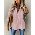 Soft pink loose long sleeve blouse with sleeve lapel button detail and two chest pockets with rolled-up sleeves