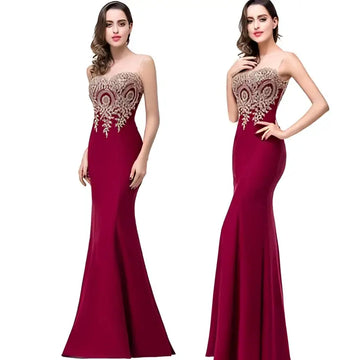 A deep red mermaid bride toast gown featuring intricate gold beading along the bodice and neckline