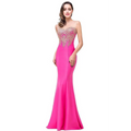 A vibrant fuchsia red mermaid bride toast gown with a strapless, intricate gold beaded bodice and pink embroidery
