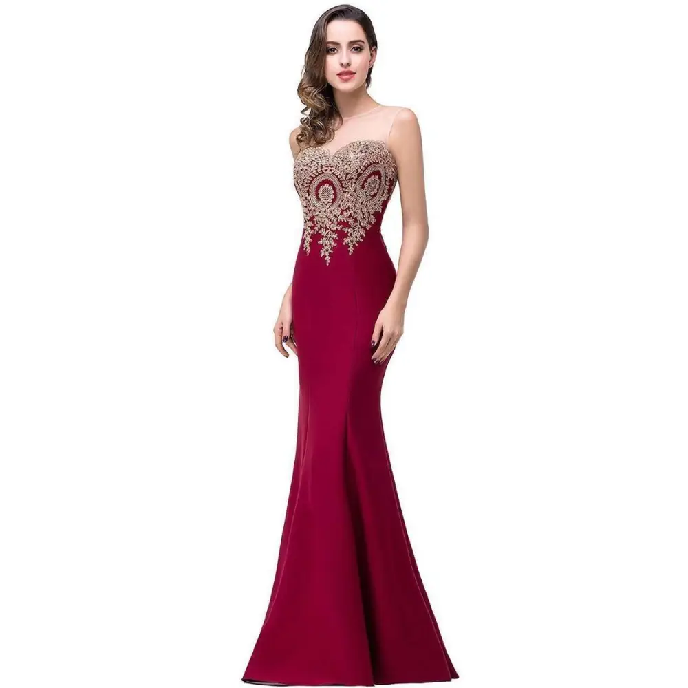 A deep red mermaid bride toast gown with a sweetheart neckline and intricate gold beading on the bodice
