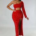 A dazzling red one shoulder gown featuring fashionable sequins sexy design with navel split and long sleeve