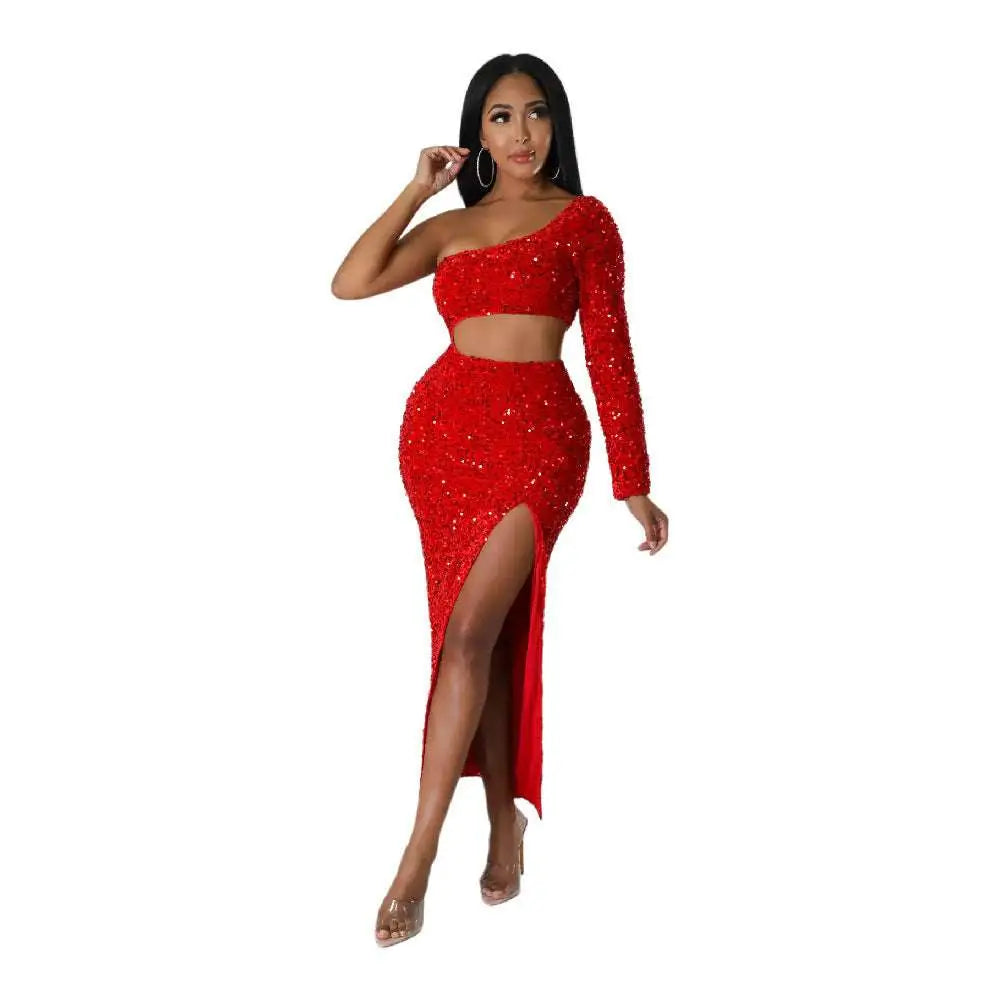 A dazzling red sequined two-piece set with a one-shoulder crop top and sexy navel split midi skirt featuring fashionable sequins