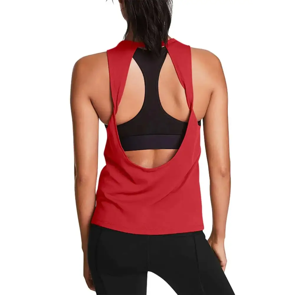 Back view of red open back workout tank with cut-out design layered over black sports bra for yoga workout clothes