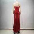A shimmering red paillette tube high slit sequin gown with thin straps and a fitted silhouette