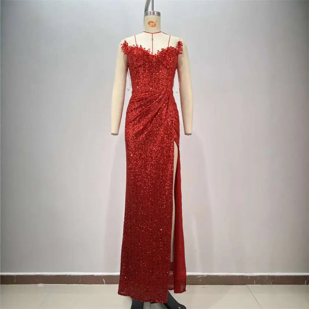 A shimmering red paillette slit sequin gown with a sweetheart neckline tube high slit and thin spaghetti straps