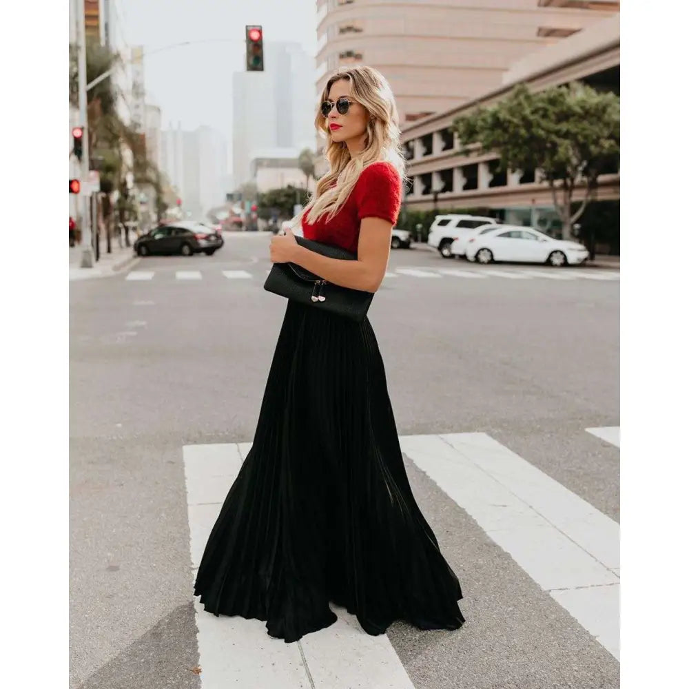 A flowing vibrant red pleated maxi skirt with high waist is perfect for women fashion casual wear