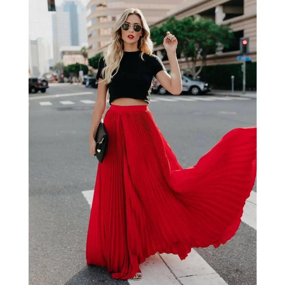 A flowing vibrant red pleated maxi skirt with high waist is perfect for women fashion casual wear