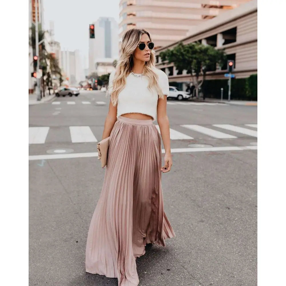 A flowing dusty rose pleated maxi skirt with high waist made of soft fabric for women fashion casual wear