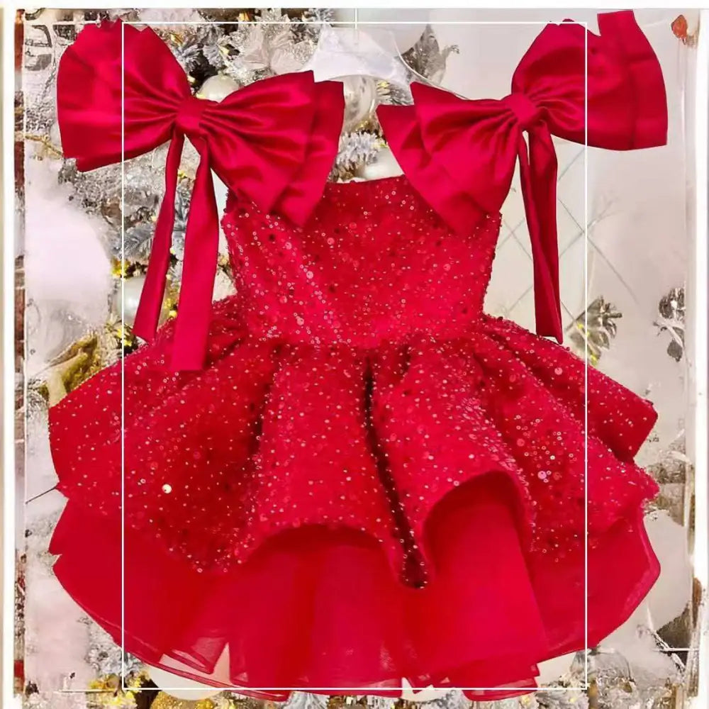 A vibrant red princess dress with tulle tutu skirt and off-the-shoulder satin bow sleeves for toddlers
