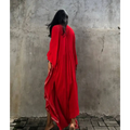 A flowing red rayon embroidered holiday sun protection cardigan with intricate white embroidery on hemline and sleeves