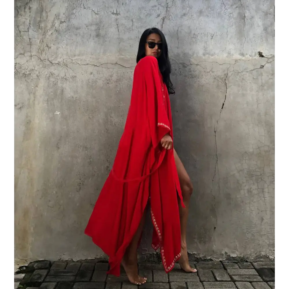 Red rayon embroidered holiday sun protection cardigan featuring vibrant flowing maxi dress with gold trim detailing