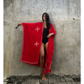 A vibrant red rayon embroidered holiday sun protection cardigan with long sleeves and white cross detailing