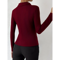 A fitted long-sleeved maroon red ribbed knit top with collar showcasing a fashionable slim fit polo design