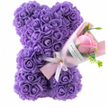 A plush purple rose bear made of foam roses with pink ribbon and bouquet in a red rose bear eternal flower gift box