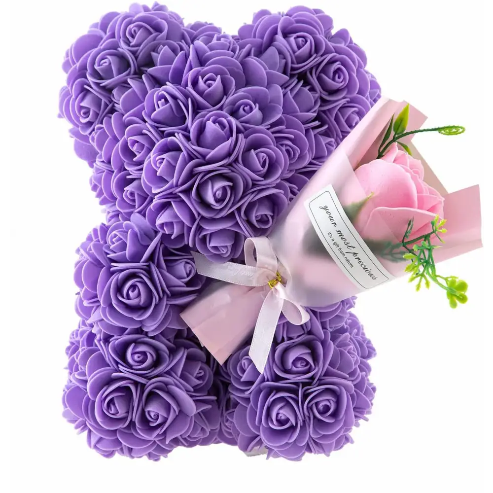 A plush purple rose bear made of foam roses with pink ribbon and bouquet in a red rose bear eternal flower gift box