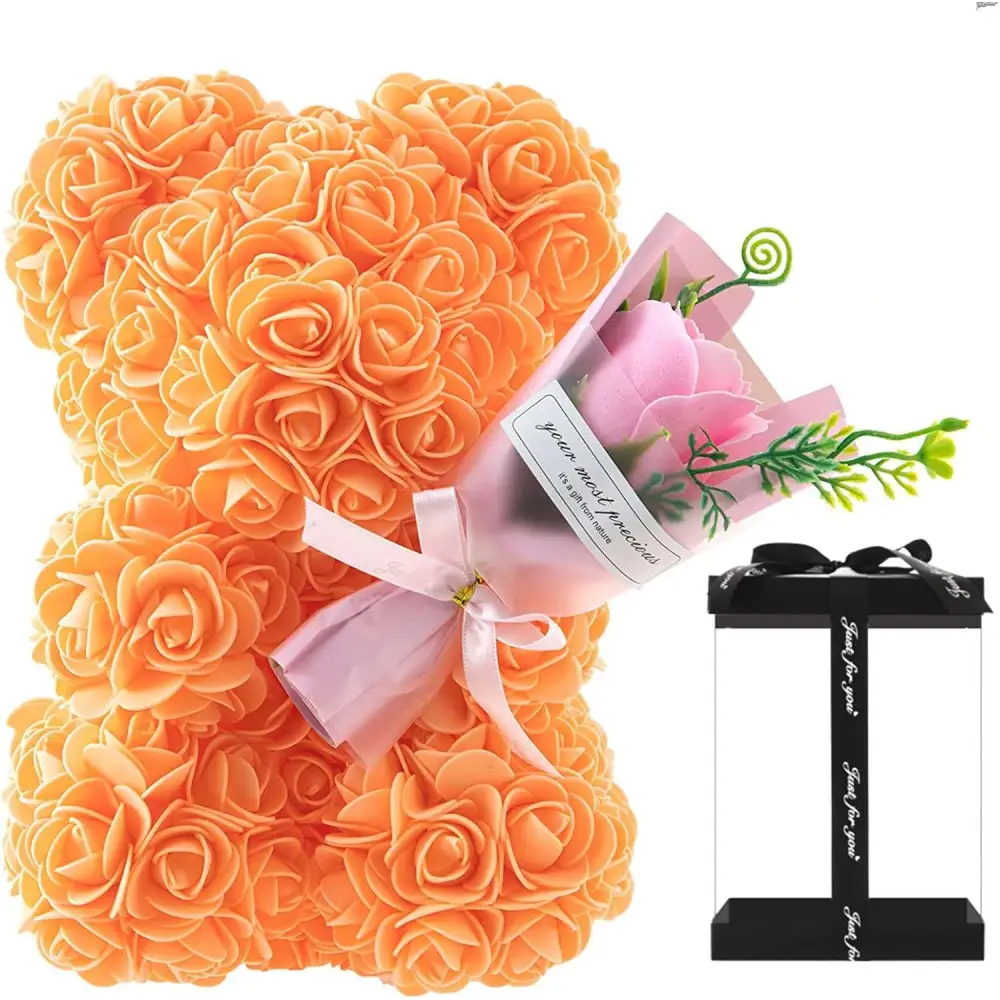 Red rose bear eternal flower gift box featuring an orange rose bear figurine with pink ribbon and floral bouquet in clear packaging