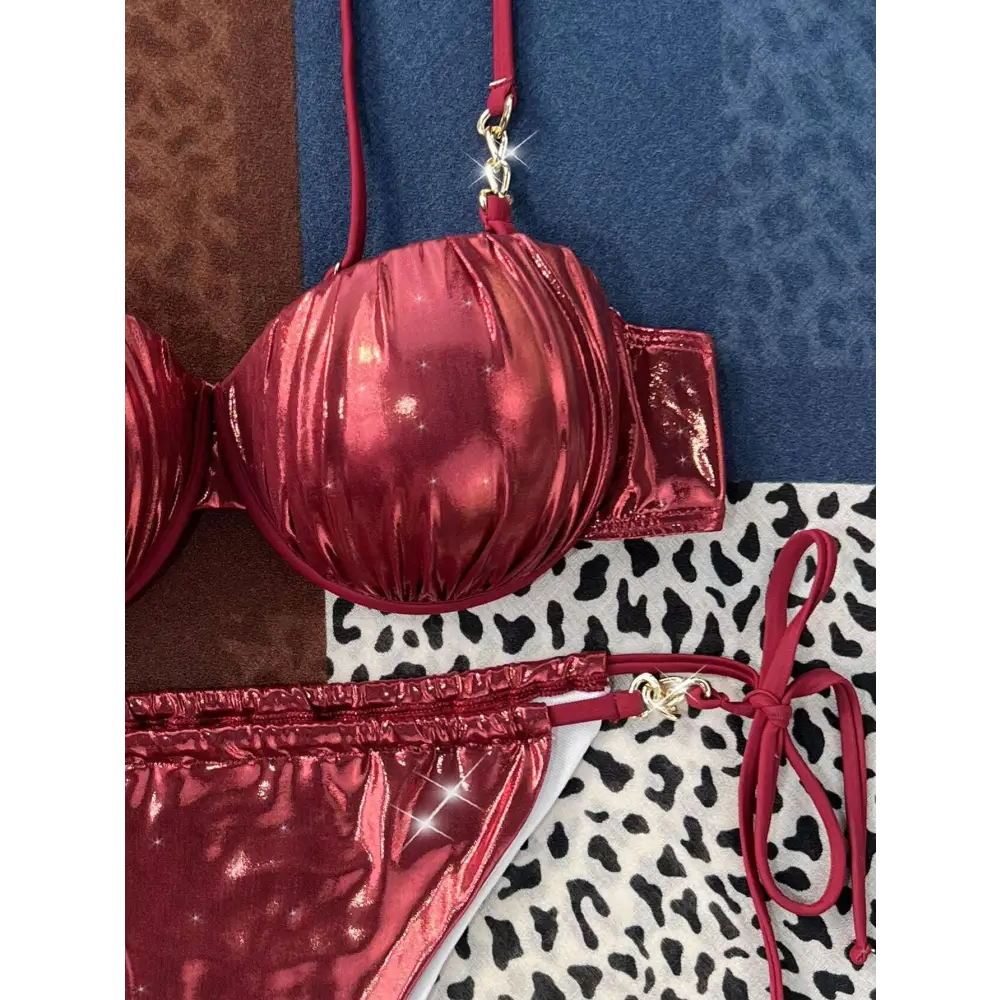 Shiny crimson metallic bikini top with red ruched steel bracket push up and gold toned hardware detailing