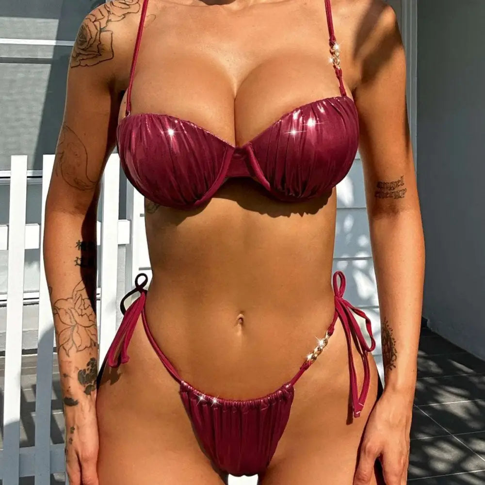 A shiny deep burgundy red ruched steel bracket push up metallic bikini with ruched fabric and sparkling strap embellishments