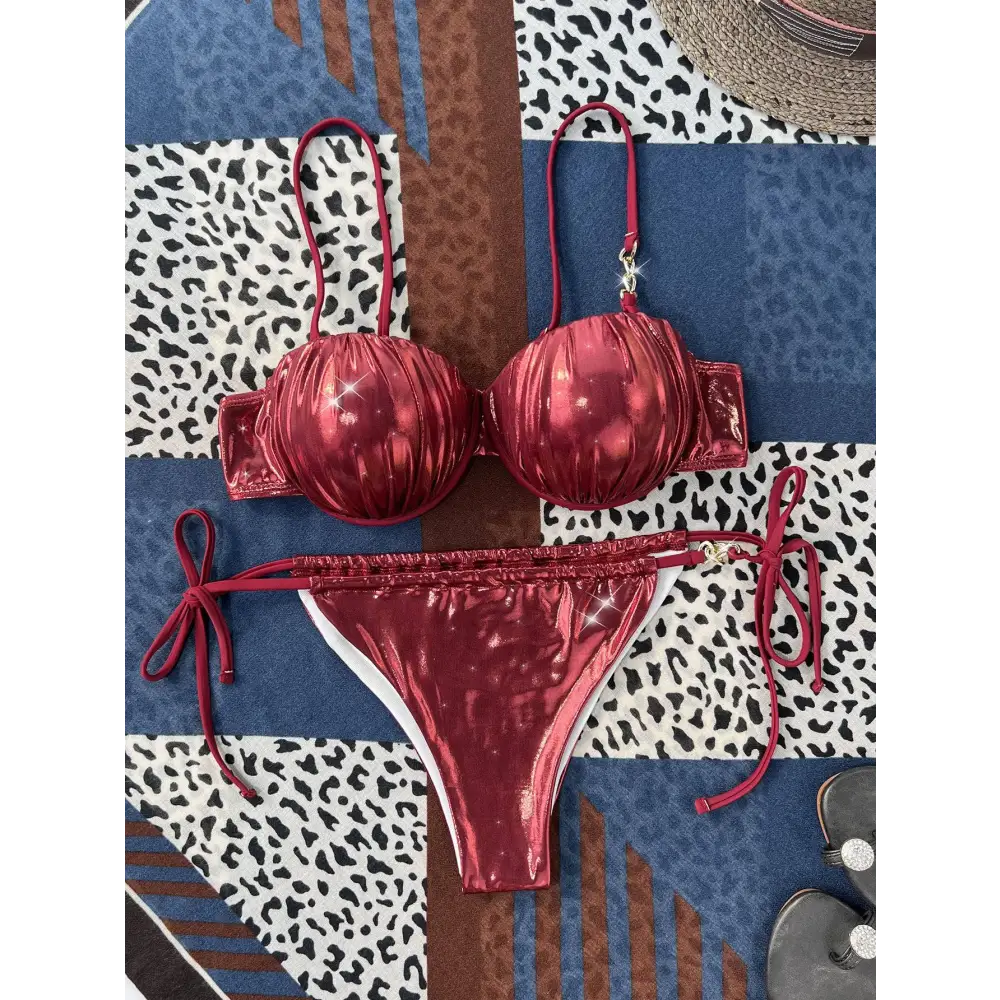A shiny deep red ruched metallic bikini set with steel bracket push up and gold tone hardware accents