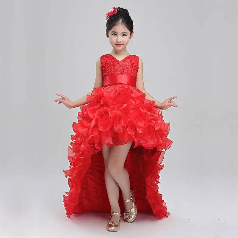 A vibrant red sleeveless lace bodice ruffled girls dress wedding flower girl gown with a high low layered skirt