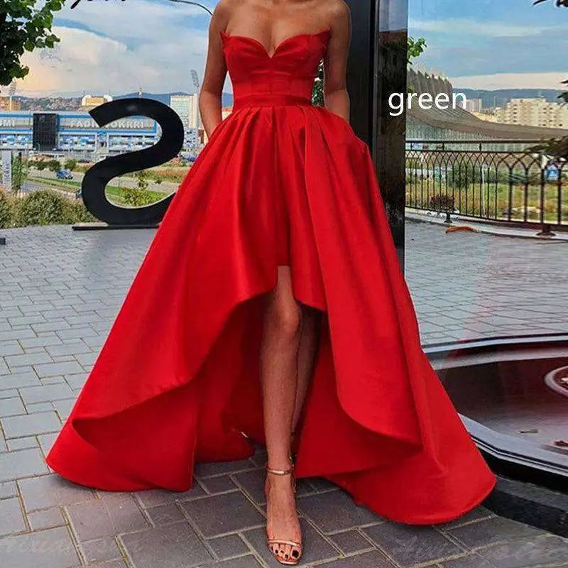 A vibrant red satin strapless ladies evening dress with a high low hemline and sweetheart neckline