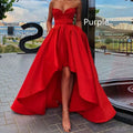 A vibrant red satin ladies evening dress with a sweetheart neckline and high low hemline design