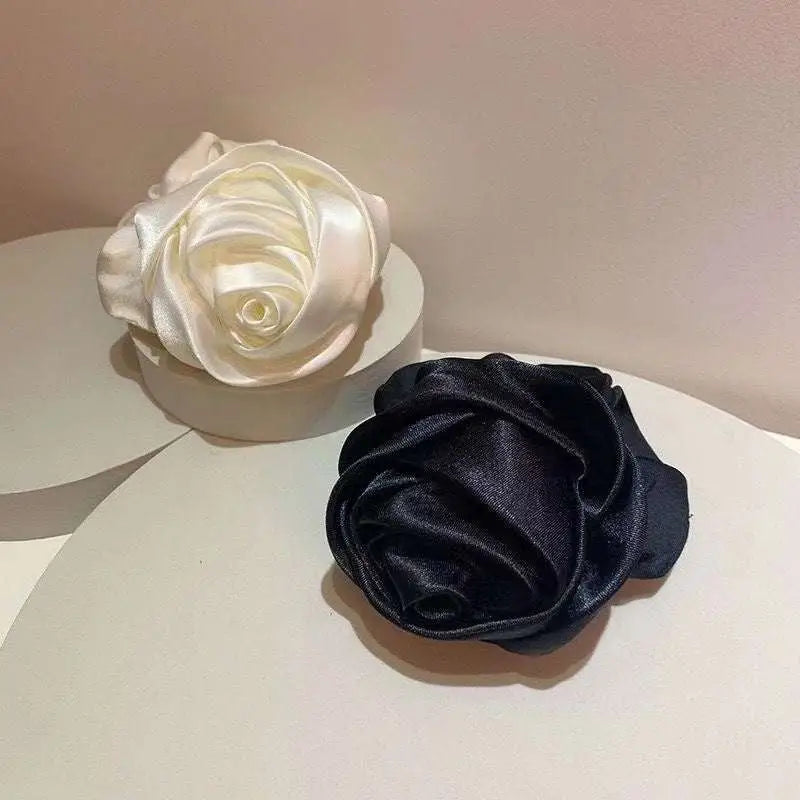 Elegant cream and black satin rose hair band with soft glossy finish for bun ponytail advanced sense styling