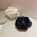 Elegant cream and black satin rose hair band with soft glossy finish for bun ponytail advanced sense styling