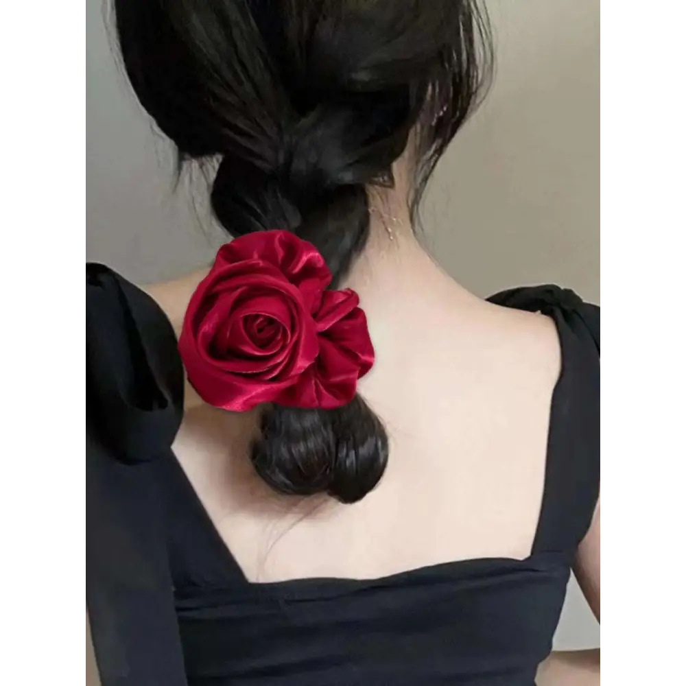 A vibrant red satin rose hair band designed for bun ponytail advanced sense styling accessories