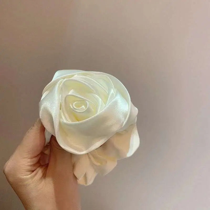 Ivory satin rose hair band with softly folded petals and subtle sheen for bun ponytail advanced sense styling