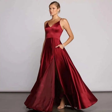 A flowing red satin temperament long dress with v-neckline and high slit designed for elegant evening wear
