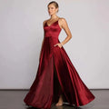 A red satin temperament long dress featuring a deep v-neckline and a flowing high slit for elegant evening wear