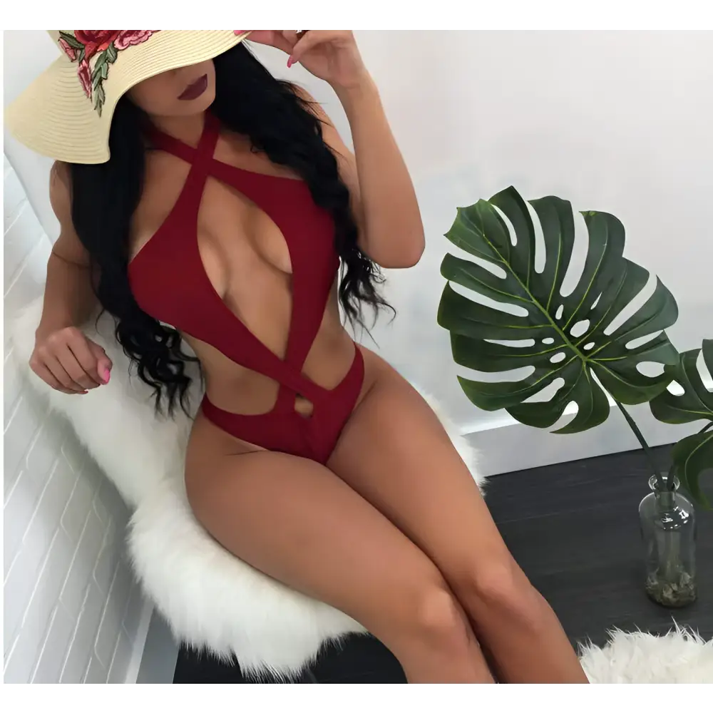 Red sexy halter one piece swimsuit with crisscross design and cut out details perfect for beachwear and poolside lounging